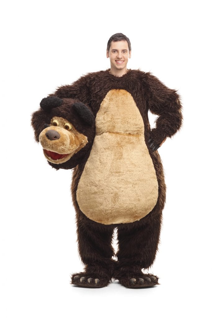 Full length portrait of a young man in bear costume
